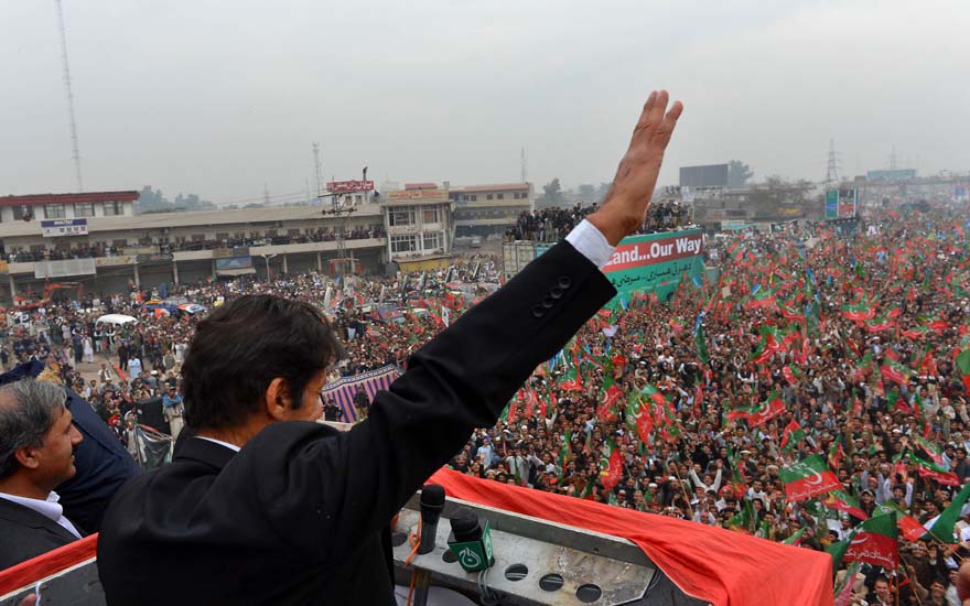 Imran Khan, Chairman of Pakistan Tehreek-e-Insaaf (PTI) party, gestures while addressing a protest rally in Peshawar on November 23, 2013. Thousands of Pakistani activists from right-wing political parties November 23 protested against US drone strikes, threating to block NATO supply routes, if strikes continue. AFP PHOTO/A MAJEED