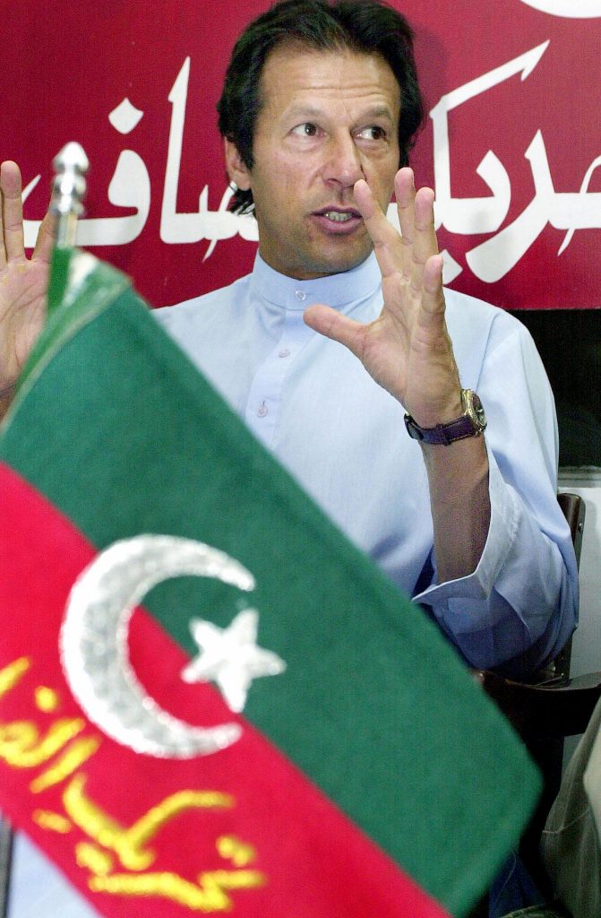 Former Pakistani cricket legend and Pakistan Tehreek-e-Insaf party chief, Imran Khan, gestures during a press conference in Islamabad, 18 June 2003. Khan, who demanded that Pakistani President Prevez Musharraf step down from his army chief post, warned that any deal struck with the United States during Musharraf's visit next week would have no legal, political or moral stance. AFP PHOTO/Jewel SAMAD / AFP PHOTO / JEWEL SAMAD