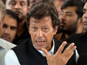 Pakistani politician Imran Khan gestures as he speaks with media representatives after a hearing at the Supreme Court in Islamabad on August 28, 2013. Pakistan's top court on August 28, 2013, dropped contempt charges against cricketer-turned-politician Imran Khan, accepting his explanation that he never intended to bring senior judges into disrepute. AFP PHOTO/ AAMIR QURESHI