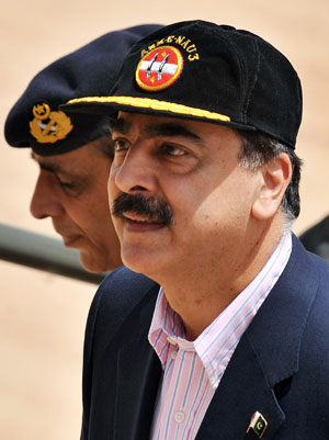 PM Gilani with General Kayani in the background. Photo: AFP