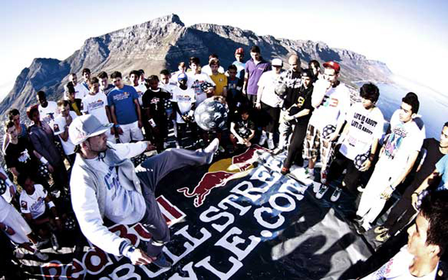 Freestyle footballer and previous world champion SÃ©an Garnier of France (centre) gathers with other freestylers, including Areeb Iqbal of Pakistan, on Lion's Head in Cape Town to practice skills. Photo: Craig Kolesky/Red Bull