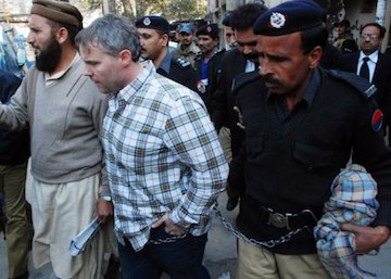 Raymond Davis is escorted from a Lahore courthouse by police in January 2011.