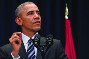 US President Barack Obama delivers remarks at the National Convention Center in Hanoi on May 24, 2016. Obama, currently on a visit to Vietnam, met with civil society leaders including some of the country's long-harassed critics on May 24. The visit is Obama's first to the country -- and the third by a sitting president since the end of the Vietnam War in 1975. / AFP PHOTO / JIM WATSON