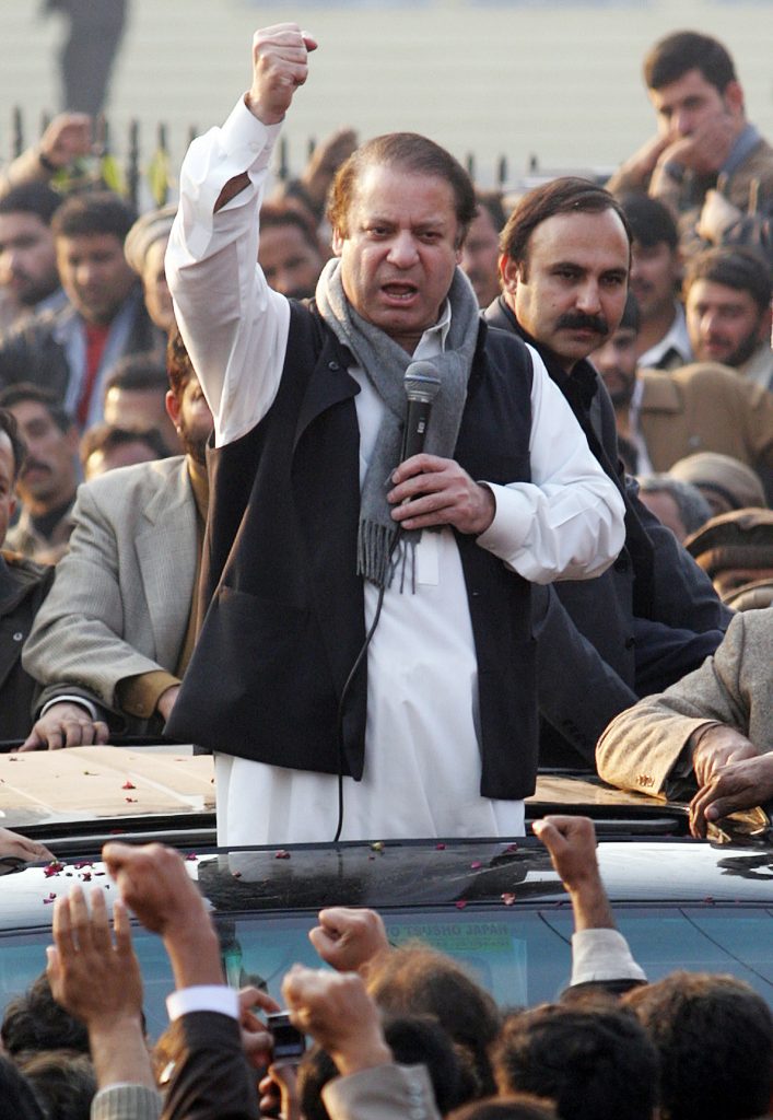 Former Pakistani prime minister Nawaz Sharif (C) gestures as he addresses supporters during a visit to Muzaffarabad, the capital of Pakistan-controlled Kashmir, 05 December 2007. Pakistan's opposition parties may finalise later a list of demands for President Pervez Musharraf to meet if he wants to stop them boycotting next month's elections, a party official said. Opposition leaders Nawaz Sharif and Benazir Bhutto joined forces on Monday and set their aides to work on a "charter of demands" for the government to satisfy before the country goes to the polls on 08 January. AFP PHOTO/Aamir QURESHI / AFP PHOTO / AAMIR QURESHI