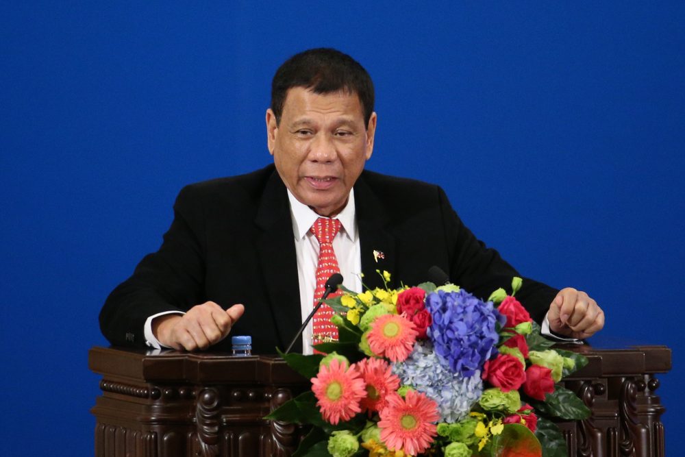 Philippines' President Rodrigo Duterte makes a speech during the Philippines-China Trade and Investment Forum at the Great Hall of the People in Beijing on October 20, 2016. Philippines' President Rodrigo Duterte and his Chinese counterpart Xi Jinping pledged to enhance trust and deepen cooperation October 20, Chinese officials said, as Manila's new leader seeks to rebalance his country's diplomacy away from the US. / AFP PHOTO / POOL / WU HONG