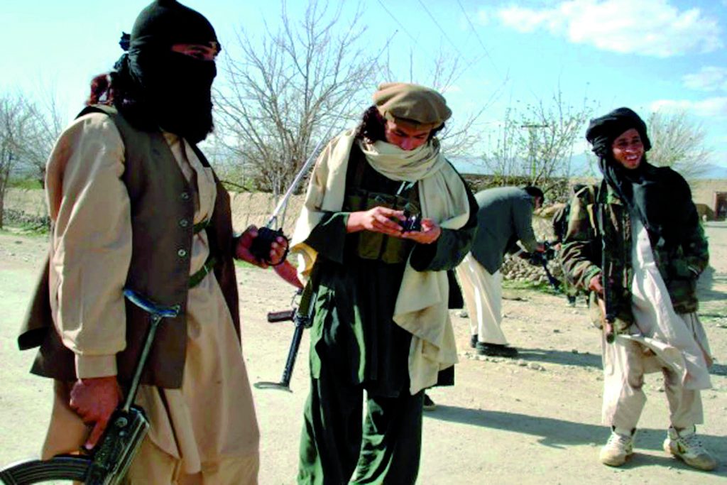 Pakistani masked tribesmen patrol with their weapons in a mountain area of Wana, in the South Waziristan tribal territory bordering Afghanistan, 04 April 2007. Forty-four Uzbek and Chechen Islamic rebels were killed 04 April along with seven tribesmen in heavy rocket and mortar clashes in the mountainous South Waziristan region bordering Afghanistan. Pakistani tribesmen beating war drums launched their biggest assault yet against foreign Al-Qaeda militants in a border region after weeks of fighting that have left 250 people dead. Islamabad says the offensive by about 1,000 conservative local tribesmen will cut cross-border attacks in Afghanistan, and shows the success of a peace deal in the lawless South Waziristan region that was criticised by the West. AFP PHOTO/S.K KHAN