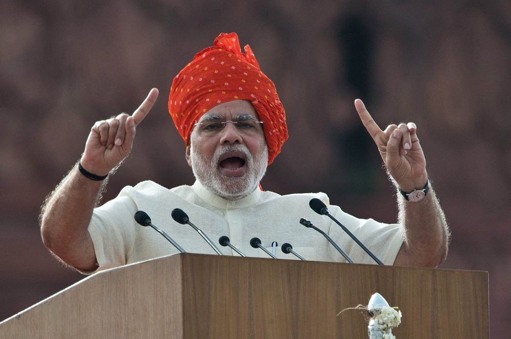 To go with ' India-Politics-Modi' FOCUS by Bhuvan BAGGA (FILES) In this photograph taken on August 15, 2014, India's Prime Minister Narendra Modi delivers a speech from the Red Fort to mark the country's 68th Independence Day in New Delhi. Narendra Modi marks the first anniversary of his landslide election win in a bullish mood about his mission to transform India into a great power, despite doubts about the delivery of economic reforms. After winning the first outright majority by any leader in three decades on May 16, 2014, Modi vowed "to make the 21st century India's century" and turn it into a driver of the global economy. AFP PHOTO/Prakash SINGH/FILES